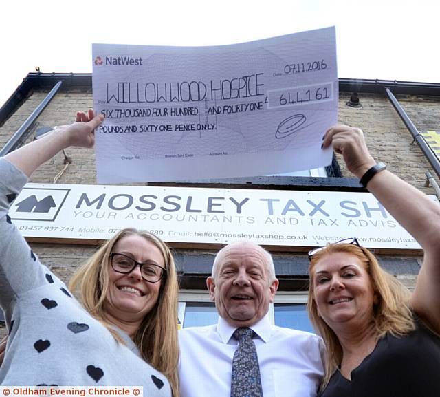 PICTURED Fiona Heyes (left) and Yvonne Cookson (right) of Mossley Tax Shop with John Fellowes from Willow Wood Hospice