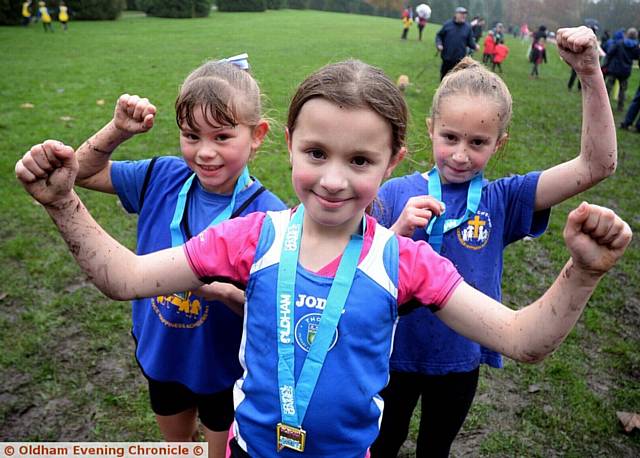 WHAT A TRIUMPH . . . pictured are the girls' Years Three and Four race medal winners (left to right): runner-up Madison Holt (St Matthew's), winner Millie Carss (Thorp) and third-placed Betsy Wood (St Matthew's).