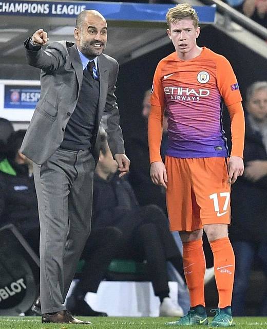 LISTEN UP . . . City boss Pep Guardiola sends out his instructions as he stands with Kevin De Bruyne