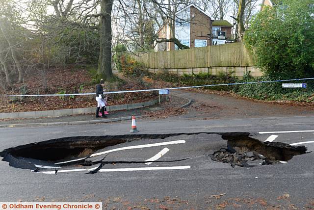A huge sink hole has appeared in the centre of Rochdale Road, near Tandle Hill Park.