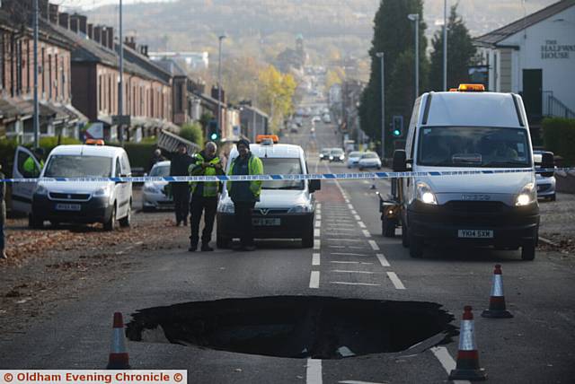 A huge sink hole has appeared in the centre of Rochdale Road, near Tandle Hill Park.