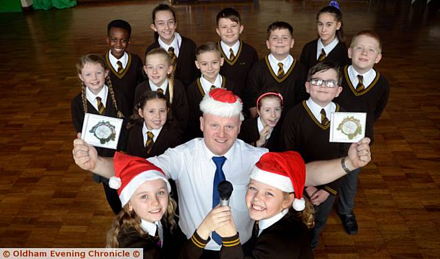 CD launch . . . (front, from left) Amelia Nolan, Nigel Mulligan and Jessica Smith with pupils who sang on the recording