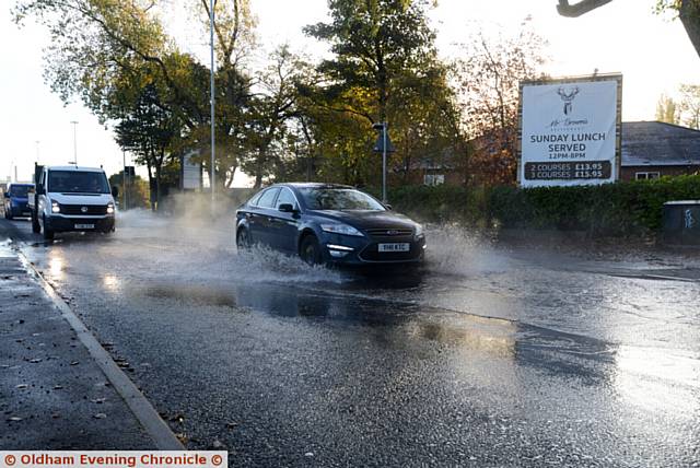 Water burst on Hollinwood Avenue next to the Victoria Hotel.