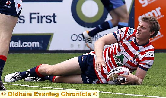 SLIGHT INJURY DOUBT: Oldham centre Jon Ford, pictured scoring a try.