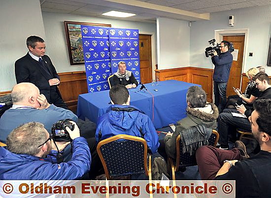 FACING THE PRESS . . . Neil Joy (left, standing) and returning Athletic manager John Sheridan.