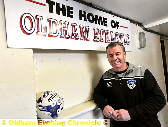 BACK ‘HOME’ . . . John Sheridan is all smiles as he prepares for his second stint as manager of Athletic. 