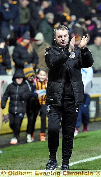 WELCOME BACK . . . John Sheridan applauds what was a terrific reception from Athletic fans as he heads for his technical area at Valley Parade.
