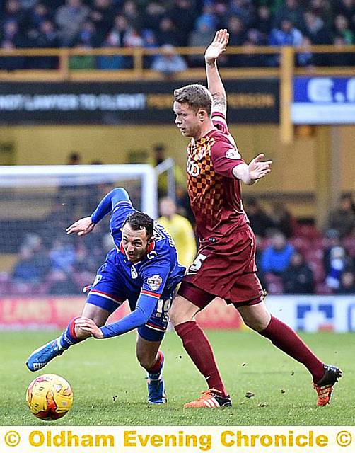 MURPH ON THE BURST: Rhys Murphy tries to find a way past two Bradford City opponents.