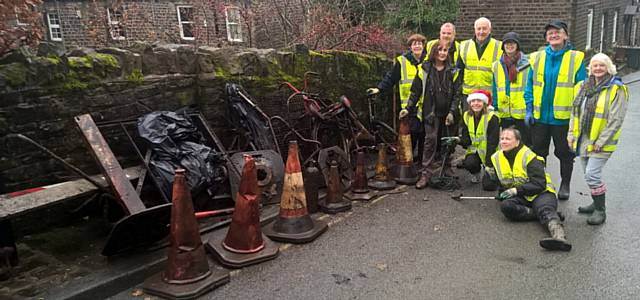 MUD-CLAD bikes, fencing and garden furniture were discovered by the Uppermill clean-up team.