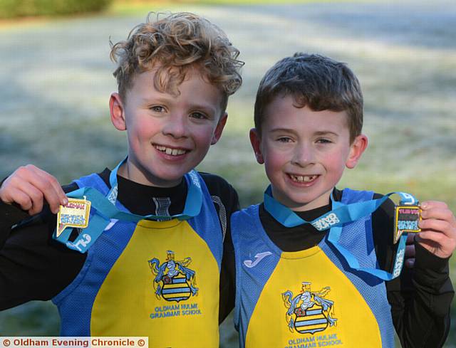 WELL DONE . . . Cole Earley (left, Hulme) won the boys' Years Three and Four race. School-mate Harrison Byrom (right) finished in second place