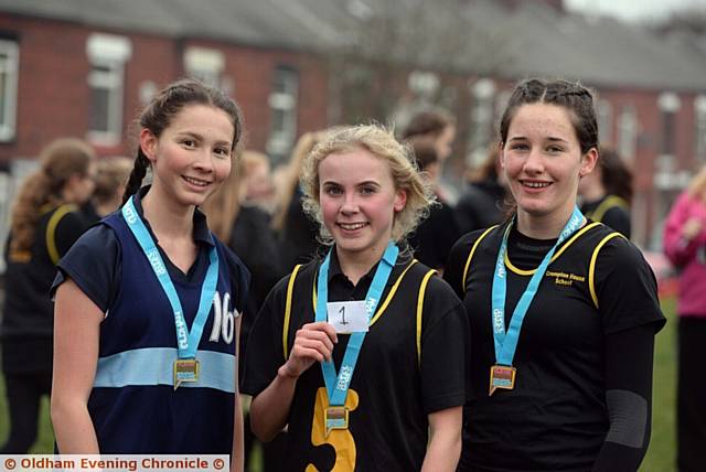 Oldham Schools Seniors Cross-Country Championships at Oldham Edge, Oldham. Y10 Girls winners (l-r) 2nd Daisy Shepherdson (15) Saddleworth, 1st place Sophie Andrew (14) Blue Coat and 3rd Nancy Chadwick (14) Crompton House.
