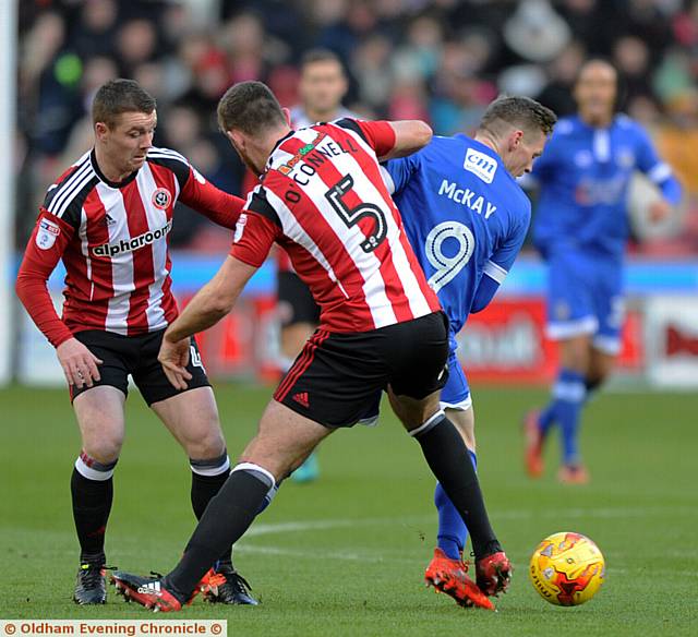 IT'S BEHIND YOU...Athletic forward Billy Mckay and Sheffield United defender Jack O'Connell battle for the ball