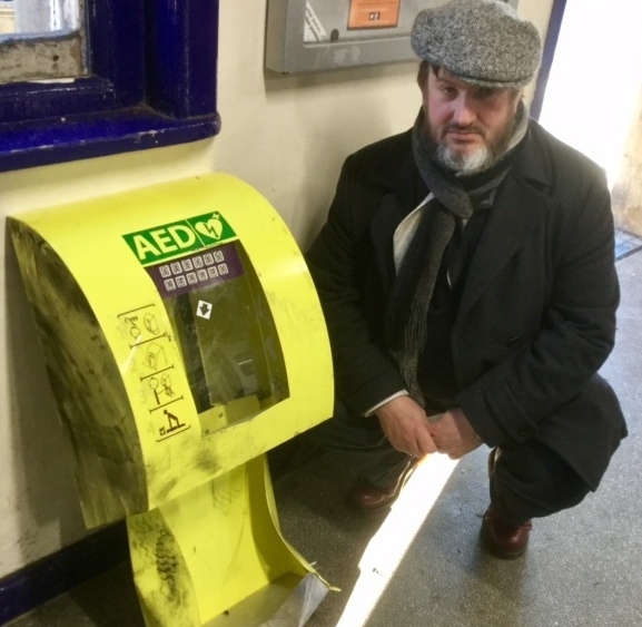ANDREW Holstead, secretary of The Friends of Mossley Station, with the vandalised defibrillator
