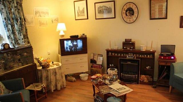 DECOR at the Oldham memory room, including a black and white television