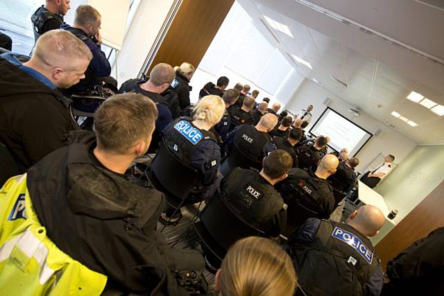 Police officers are briefed ahead of Operation Bauble