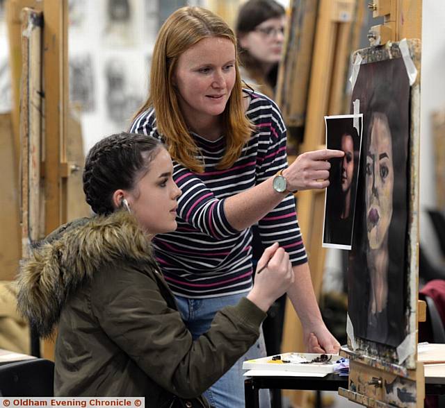 Oldham Sixth Form College, Oldham. Portrait artist Stefanie Trow working with students. Pictured here are student Lilly Maloney-De Leeuw Van Weenen (16) with artist Stefanie Trow. 