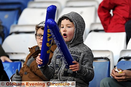 FAN-TASTIC . . . a youngster armed with thundersticks tries his best to rally Athletic. 