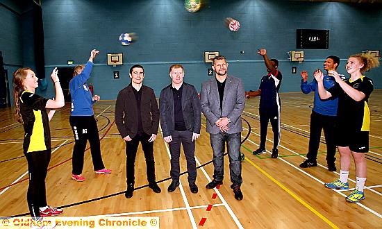 HAVING a ball . . . the handball team practice over the heads of Anthony Crolla, Paul Scholes and Barrie McDermott