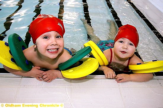 SPLASHING fun . . . Leo Carr, Evie Hughes, both aged 3, in the new pool