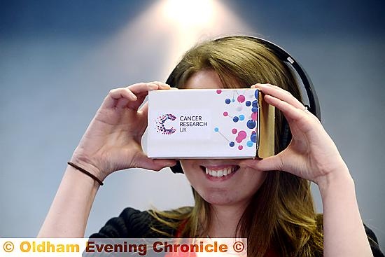 BEHIND the scenes look . . . reporter Lucy Kenderdine tries out the Cancer Research UK virtual reality lab tour
