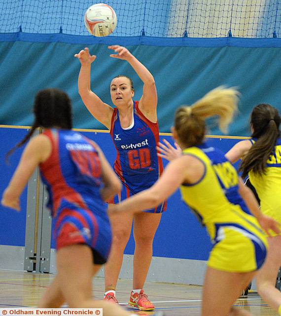OVER TO YOU . . . Oldham Netball Club's Gemma McDermott looks to pick out a team-mate.