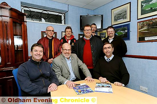 WELCOME TO THE FOLD . . . Oldham RL chairman Chris Hamilton (back row, centre) and some of his match-day staff are pictured with Stalybridge Celtic FC directors Ian Milligan (front, left), Syd White and Gordon Greenwood.