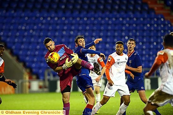 UNDER PRESSURE . . . Athletic’s Dylan King forces Luton Town goalkeeper Liam Gooch to fumble the ball. 
