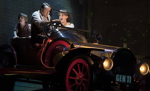 ON THE MOVE . . . Jeremy Potts (Henry Kent), dad Caractacus (Jason Manford) and Truly Scrumptious (Charlotte Wakefield) take a spin in Chitty. 