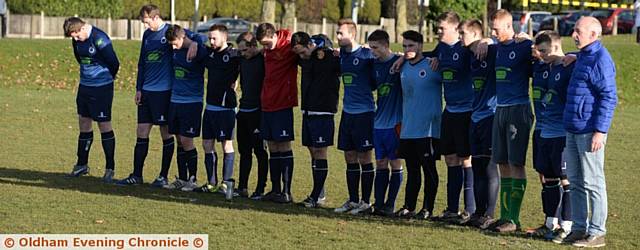 TOTAL RESPECT . . . Royton Park stand for a minute's silence to remember the Brazil plane crash