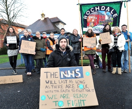 WALKOUT . . . Dr Rory Hicks and supporters outside the Royal Oldham Hospital