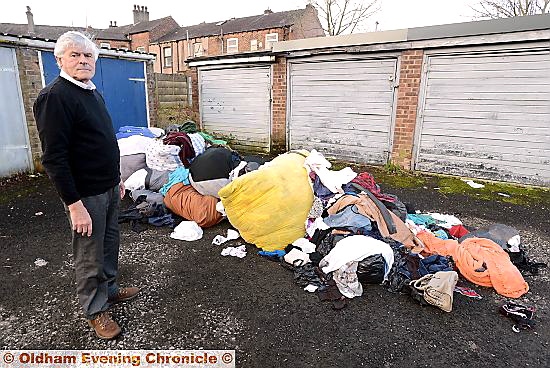 COUNCILLOR Warren Bates with the dumped rubbish