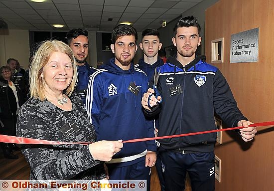 CUTTING the ribbon . . . Oldham Athletic player Jack Truelove (right) opens the lab with UCO head Helen Mathers and students (from left) Bilal Younis, Shabab Niaz and Rashad Mohammed