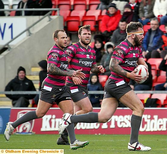TAKING UP THE ATTACK: Oldham prop Jack Spencer embarks on a forward run at Leigh.