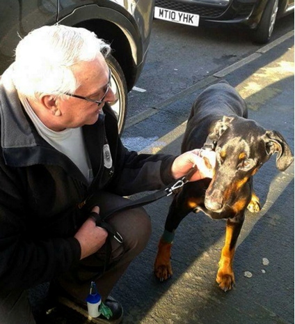 REUNITED . . . Harry Rogers with pet dog Zeus after nine days alone on the Saddleworth moors