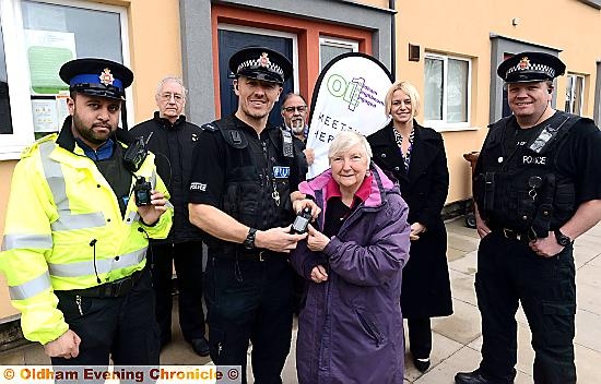POLICE receive the bodycams from First Choice Homes. From left, PCSO Imran Ahmed, resident Harry Taylor, PC Damieon Pickles, residents Andy Gregori and Jessie Perrin, FCHO community safety officer Stephanie Booth and Sgt Danny Atherton