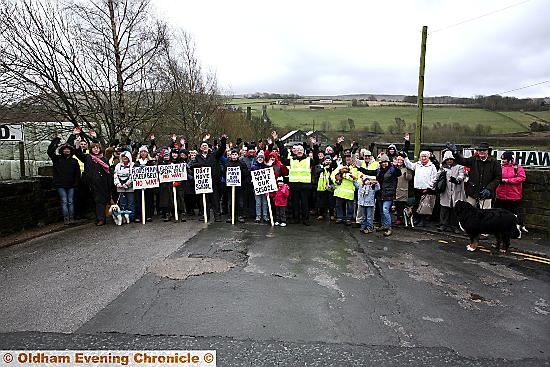 Save Diggle action group gathered at the gates of the proposed new school site . 