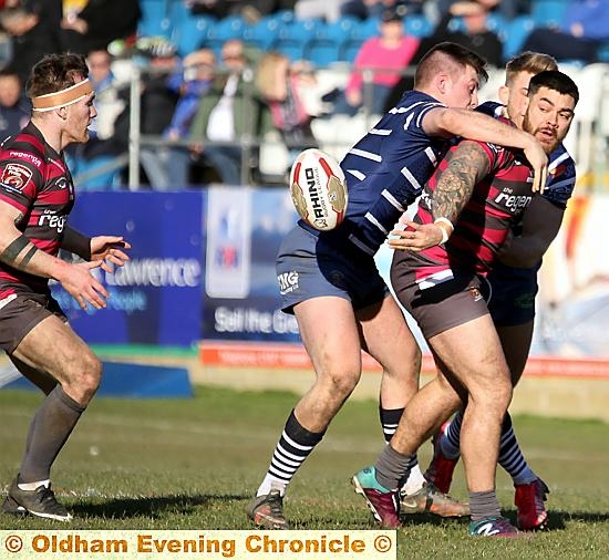 OFFLOAD: Sammy Gee, outstanding for Oldham off the bench, flicks a pass to Richard Lepori. 
