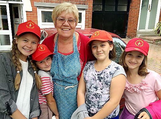 BABUSHKA . . . ‘grandmother’ Theresa Novotny with young visitors who came to Oldham last year (from left) Darya Harbunova, Hanna Savina, Dasha Pilipchuk and Anhelina Tarik