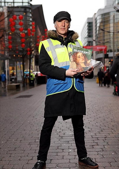 Clint Boon selling The Big Issue. 
