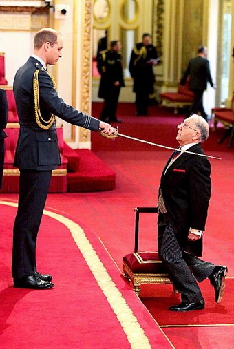 ARISE, Sir Norman... Norman Stoller is knighted by the Duke of Cambridge at Buckingham Palace.