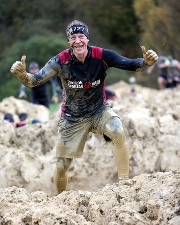 MUDDY marvellous — Steve Hill completes a gruelling obstacle course