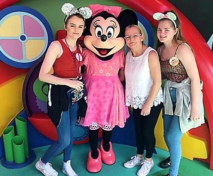 CENTRE OF ATTENTION: Bethan with her mum and sister Helen and Sophie Curran with Minnie Mouse