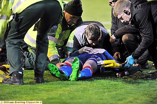 BRIAN Wilson being attended by medical staff at Barnsley.
