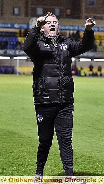 John Sheridan celebrating with the travelling fans