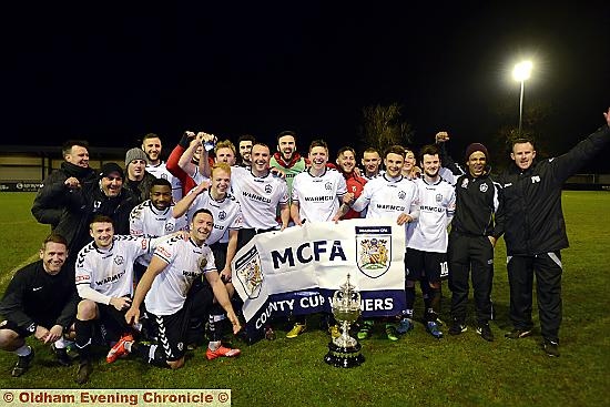 Glory boys.. Mossley players and officials celebrate their Manchester Premier Cup triumph