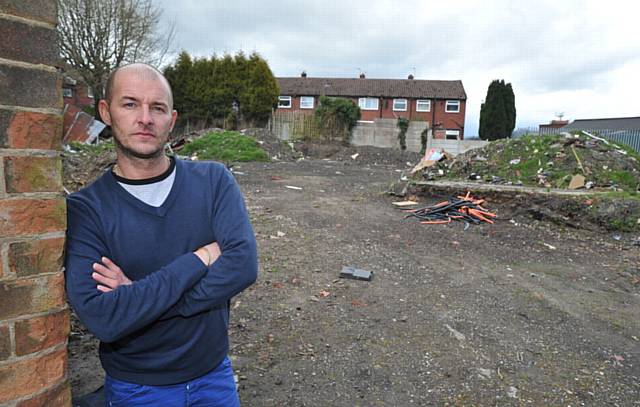 DANGER warning . . . resident John Badby complaining about land on Cardwell Street where fly-tipping has become a major problem
