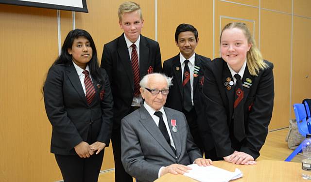 INSPIRATION... Holocaust survivor Chaim Ferster (93) visits Radclyffe School to talk about his memories of Auschwitz concentration camp. Pictured with him are year 10 pupils left to right, Samina Nishat, Michael Cassidy, Izharul Hoque, Chloe Bennett-Benedikti.