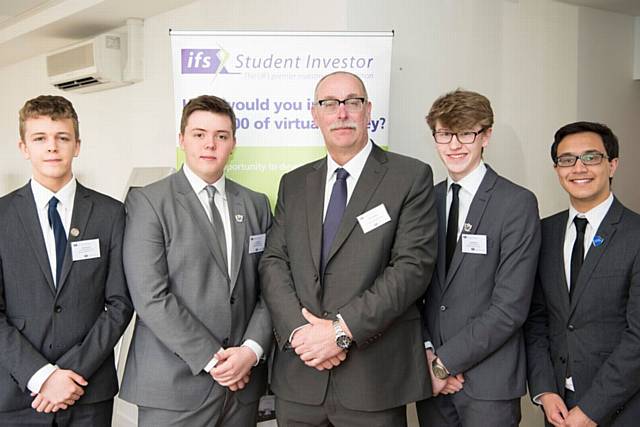 FOUR students at Hulme Grammar Schools competed in the final of the ifs (Institute of Financial Studies) Stock Market Challenge. Left to right, Ben Knightley, James Stott, teacher Paul Langdon, Jack Brierley, Varun Jain