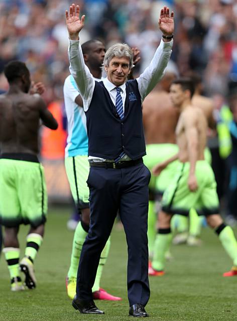 FAREWELL . . . City manager Manuel Pellegrini waves to the fans.