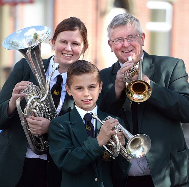 St Pauls Church, Hathershaw, Oldham Whit walk.Three generations from the Greenfield Band take part in the walk (l-r) Lindsey Rankin, Edward Rankin(9) and Norman Vizard.